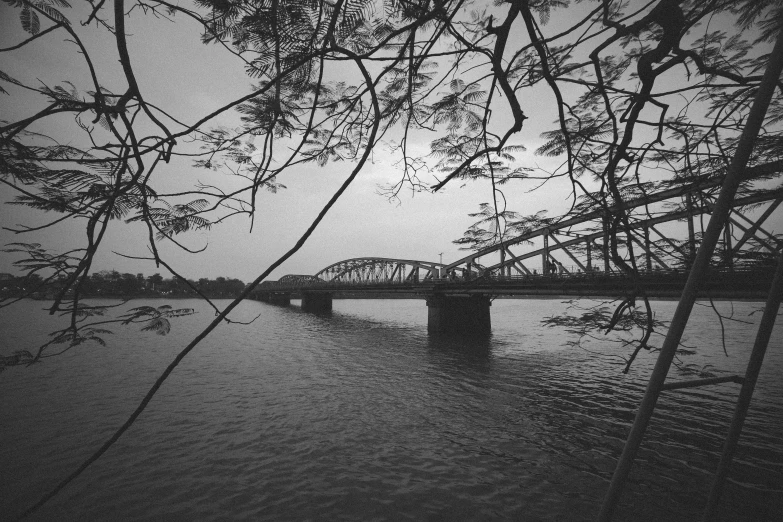 black and white po of a bridge over water