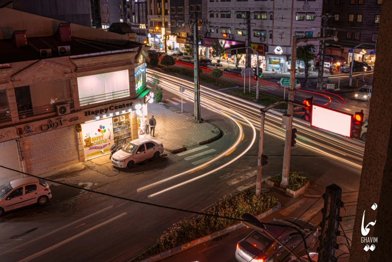 a view of the street from a hill over looking a building