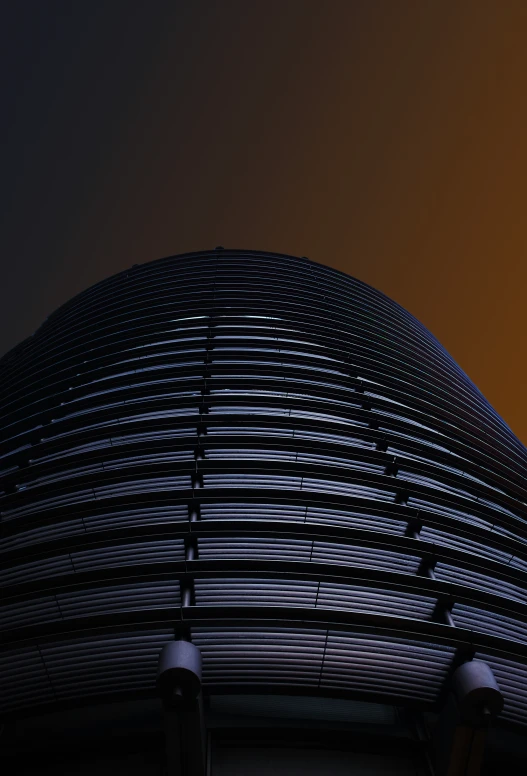 a bird flies above a building under a blue sky