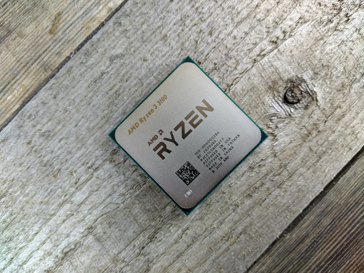 an intel processor chip sits on top of a wood table