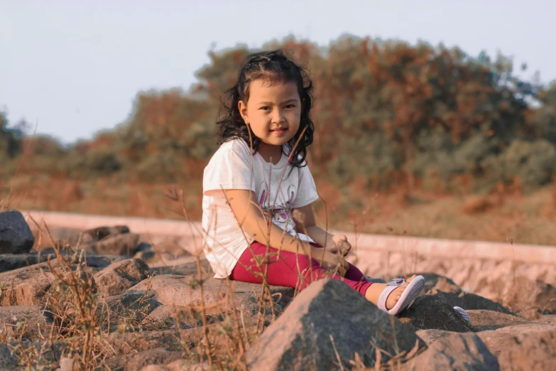 a  sitting on top of a rock