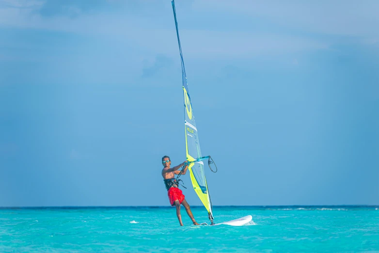 a man that is in the water with a surfboard