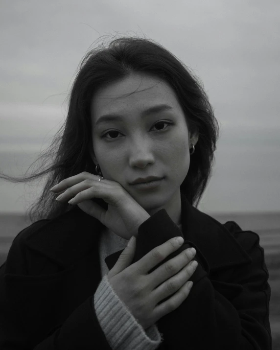 a woman posing for a portrait outside