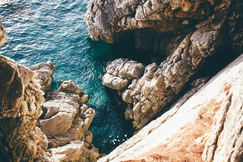 a view of some very pretty rocks and water