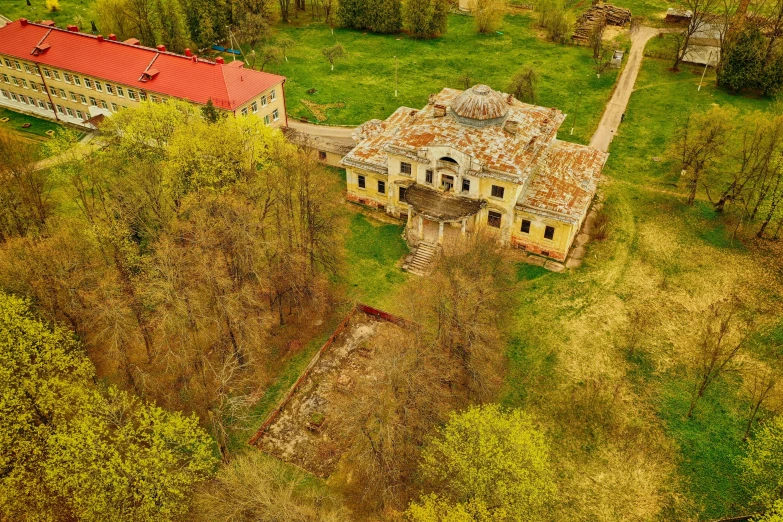 an aerial po shows the ruins of an old building in a wooded area