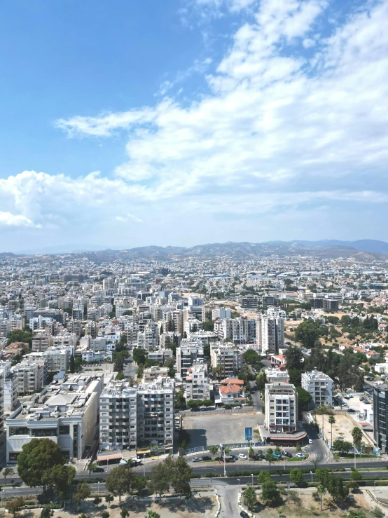 an aerial view of the city with lots of tall buildings