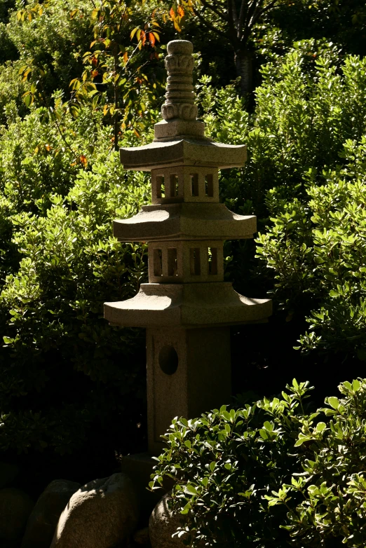 a pagoda surrounded by rocks and trees