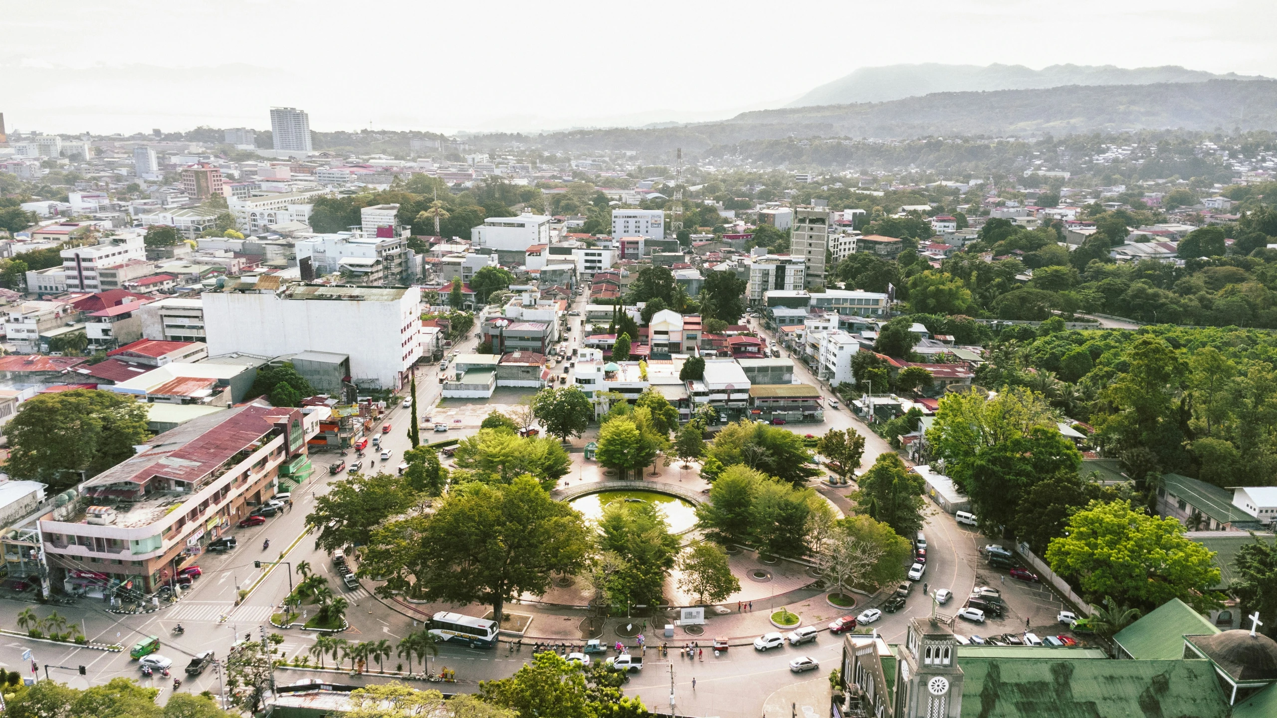 an overhead view of the city from a hilltop