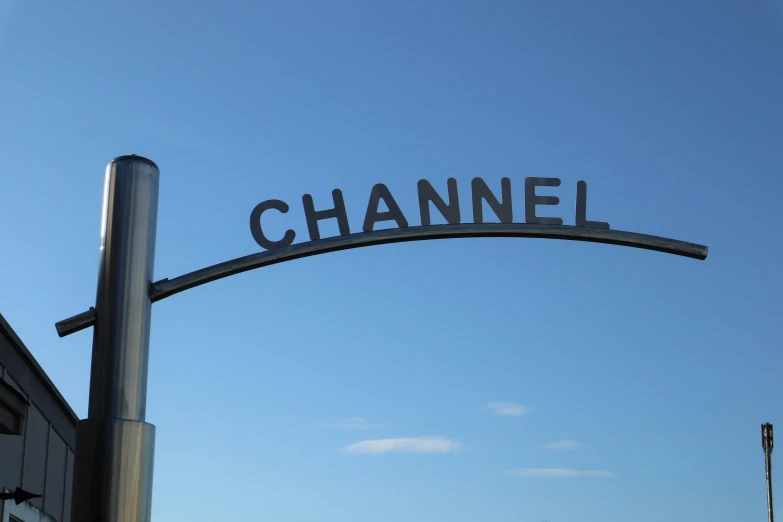 a street sign hanging off the side of a metal pole