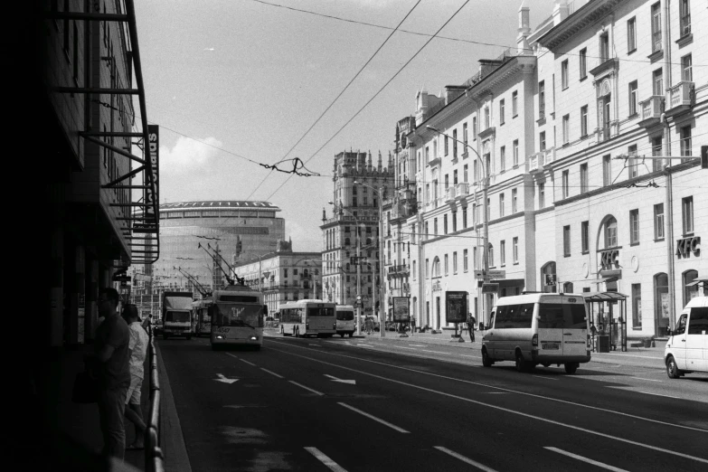 an old picture of a street with some buildings