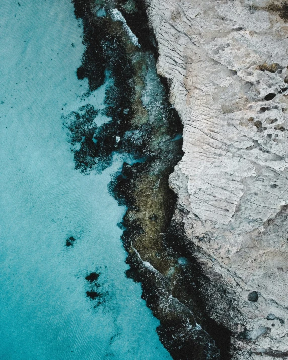 an aerial s of an area with blue water