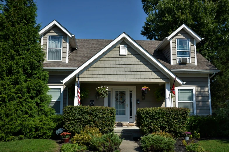 the house is in the residential neighborhood with beautiful landscaping