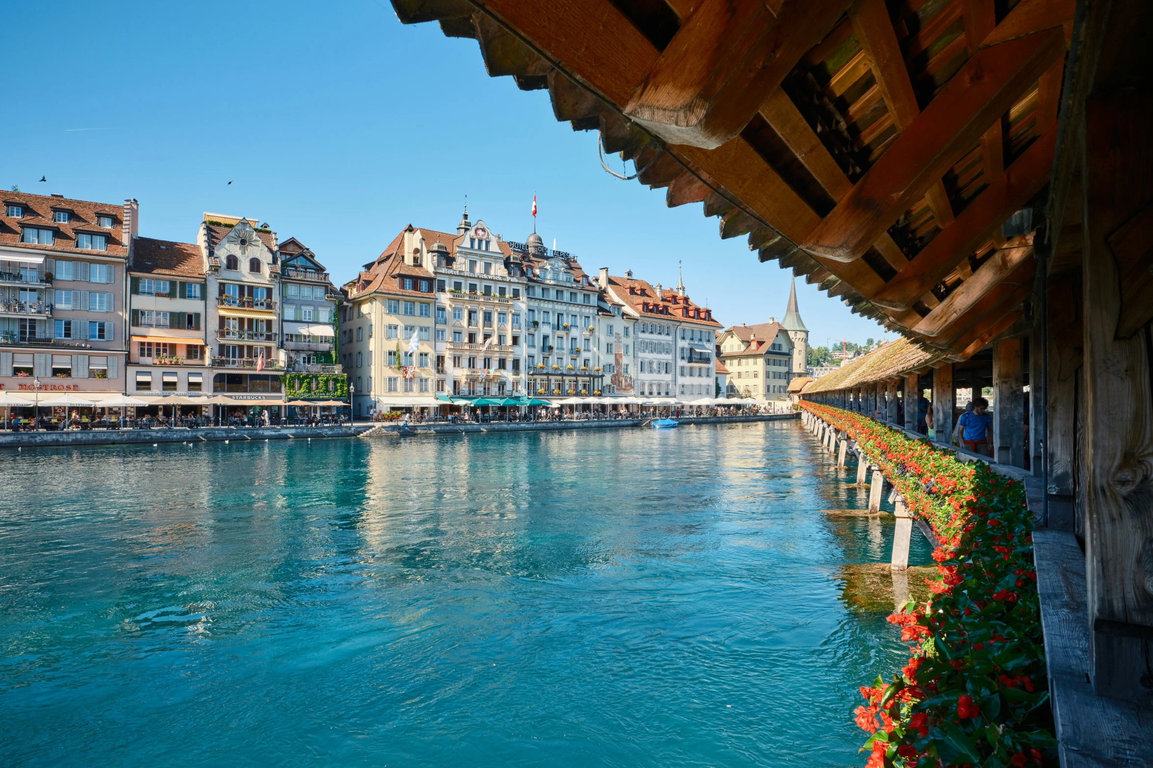 a river runs past several buildings along it