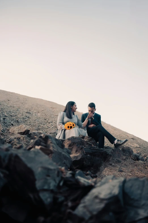 there are two people that are sitting down together