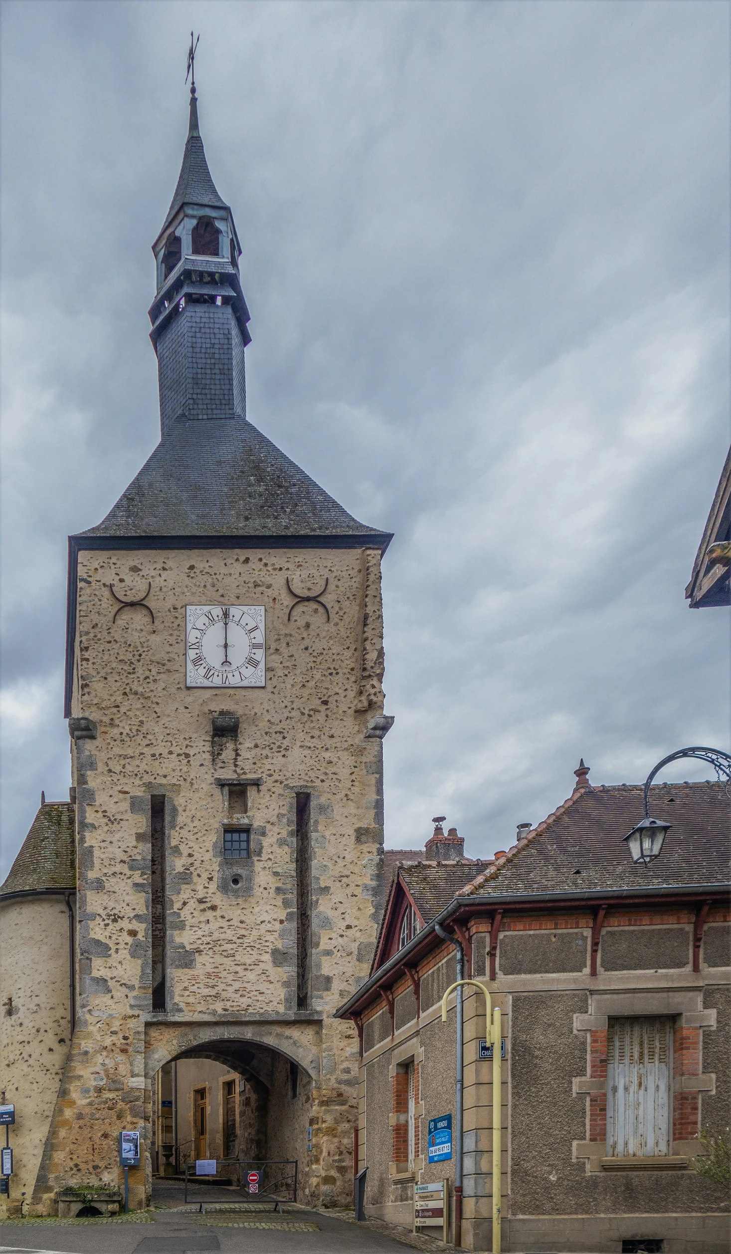 a old building with an arched roof and clock