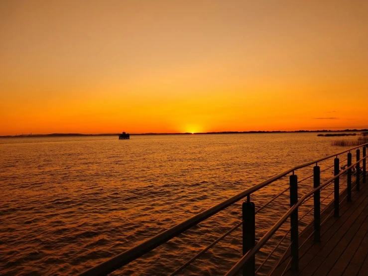 a sunset over a body of water