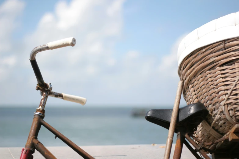 a bicycle that is parked next to a basket