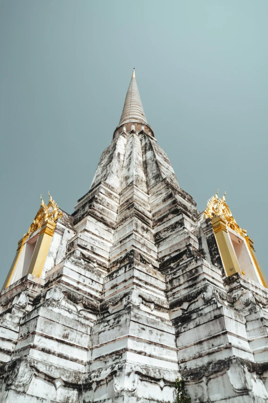 a tall building with a gold and white decoration