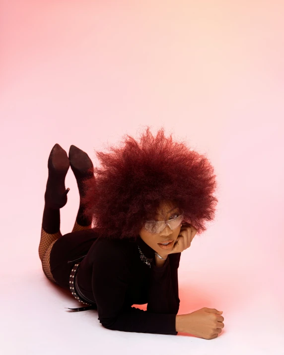 woman laying on floor posing for picture