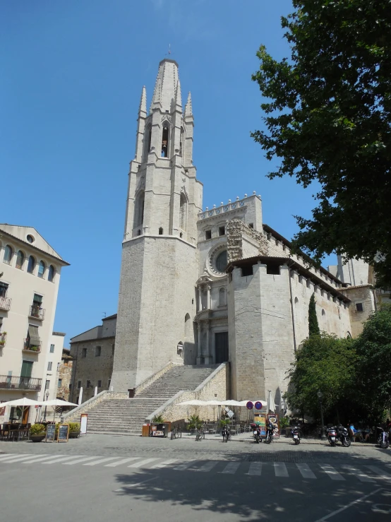 a cathedral building has an unusual spire with a clock