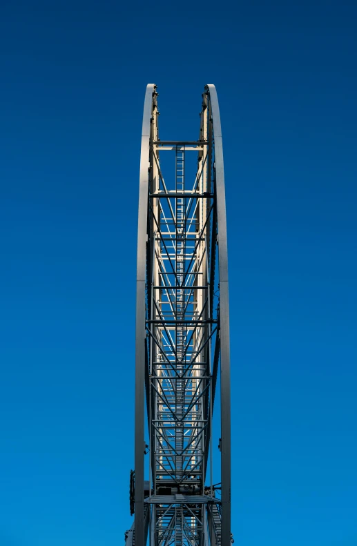 a tall steel tower sitting on top of a hill