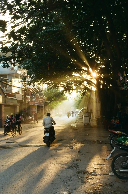 a person riding a motorcycle down a street