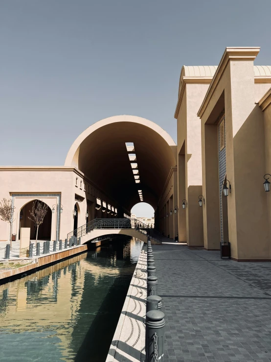 the building has arches to allow boats into the water