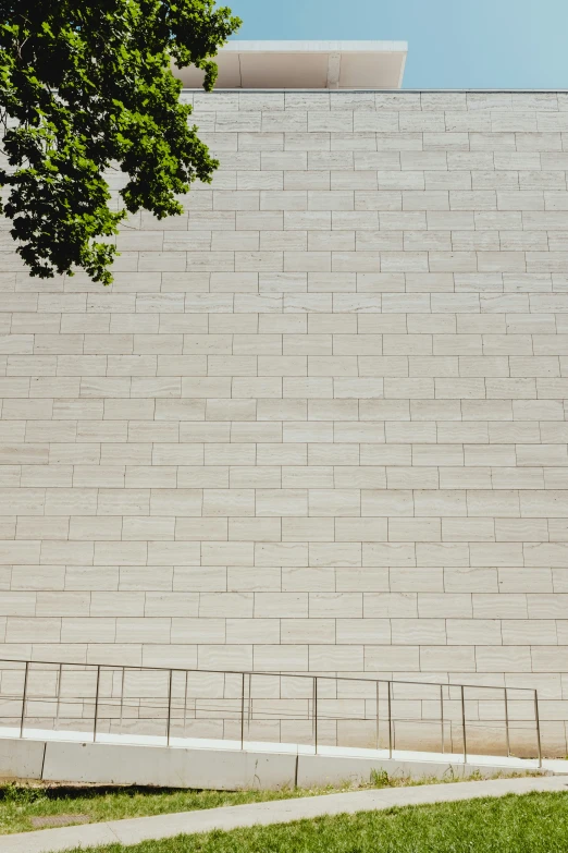 there is a clock on the side of a brick building