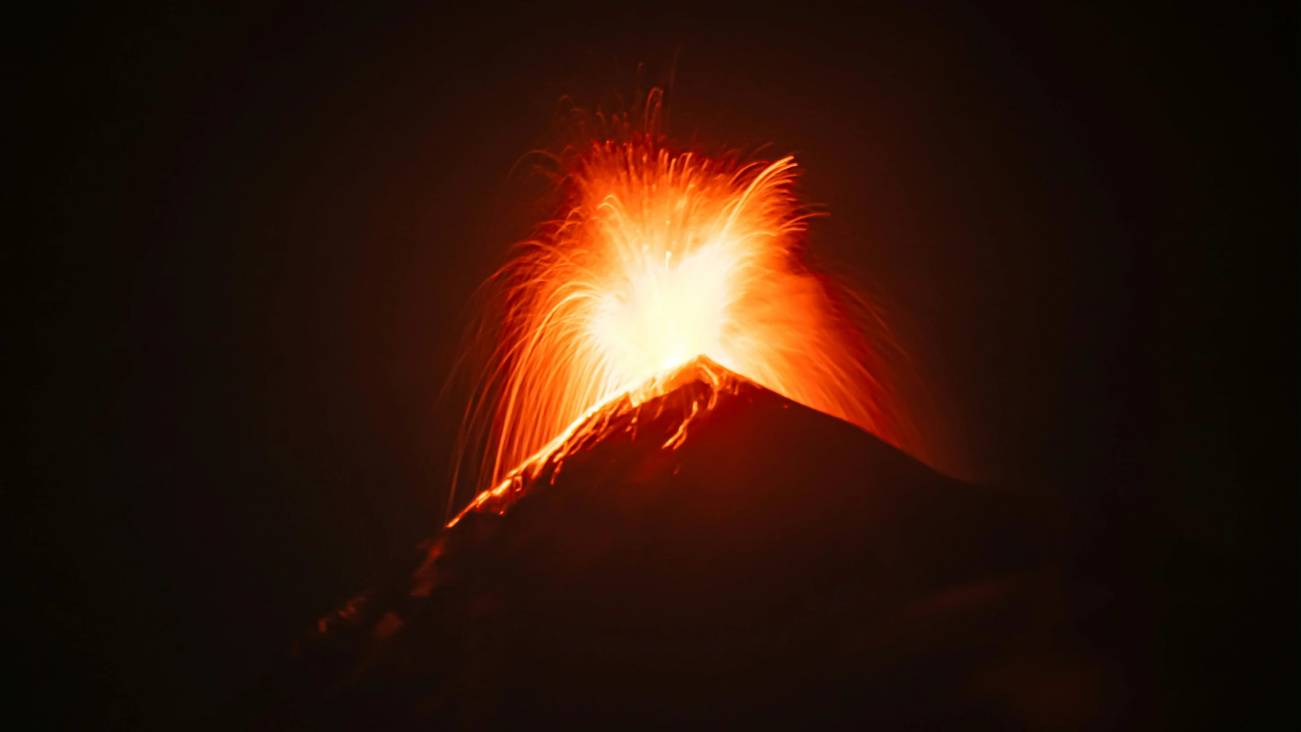 the bright fire from below shows on the peak