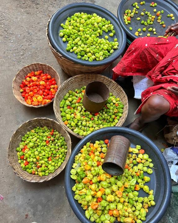 seven baskets filled with different kind of colorful food