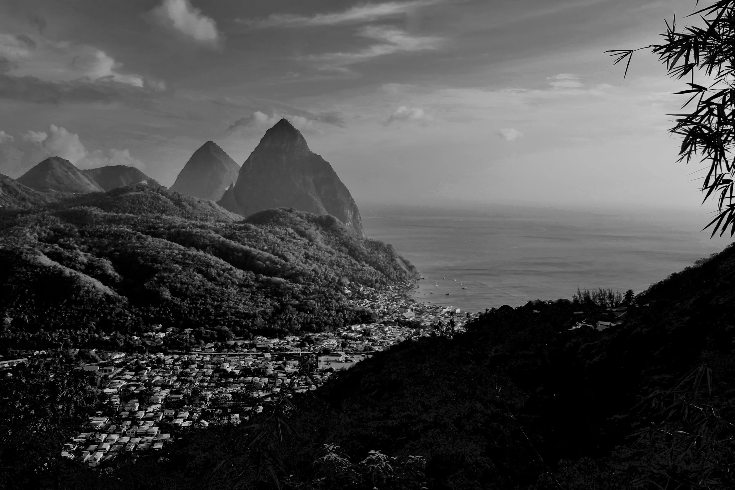 a mountain town below some steep mountains