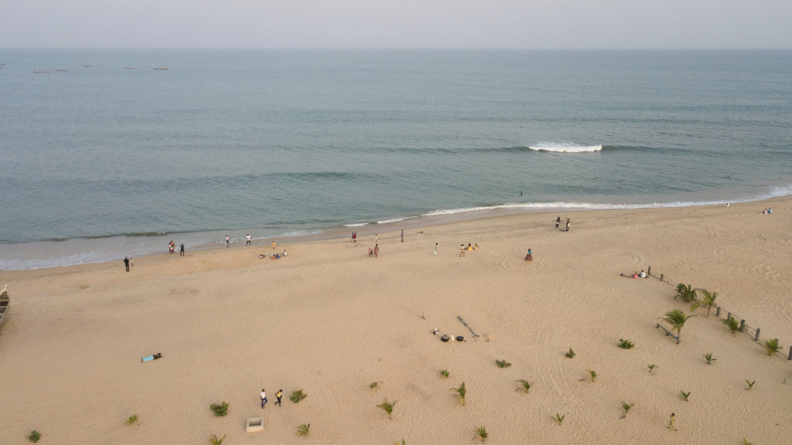 the people are on the beach by the ocean