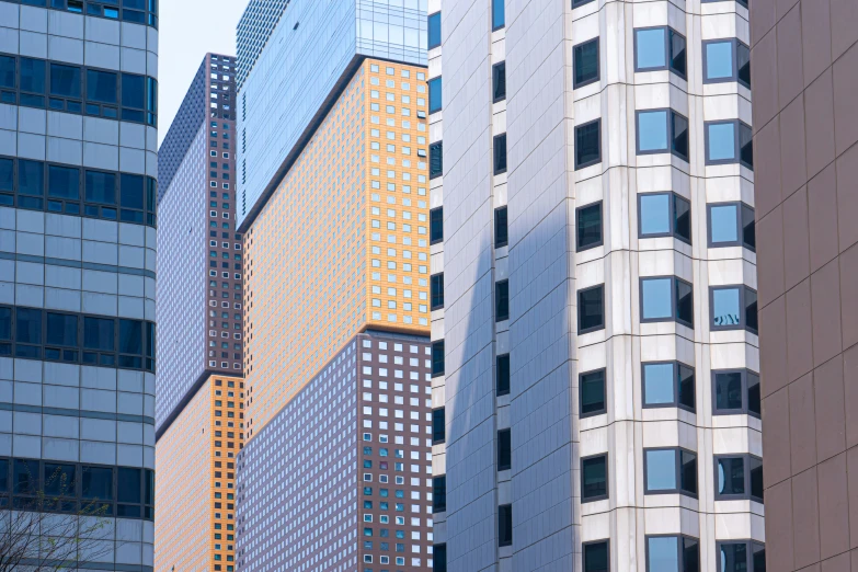 multiple tall buildings stand in the middle of the city