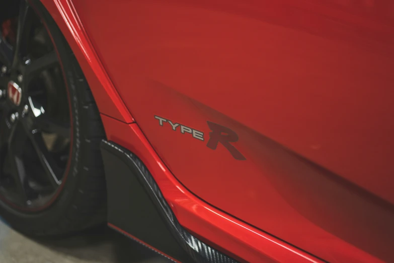 the front end of a red sports car