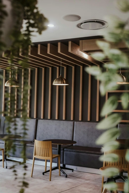 several chairs sitting on top of each other in front of wood paneled walls