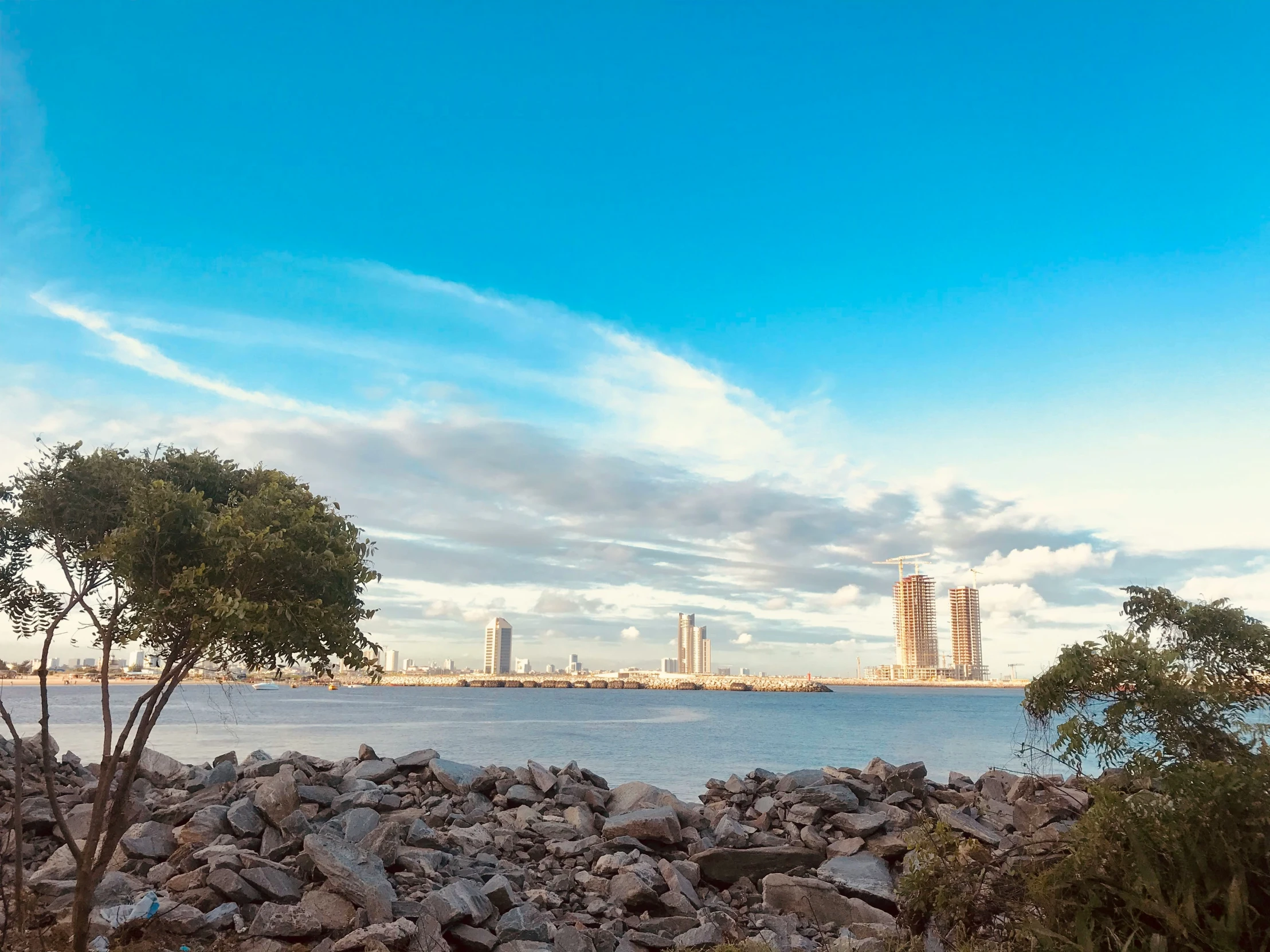 a blue sky above a large body of water