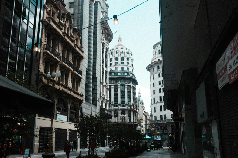 an empty street with buildings in the background