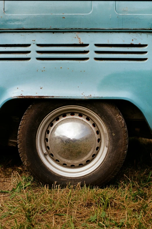 a close - up of the front of an old, blue bus