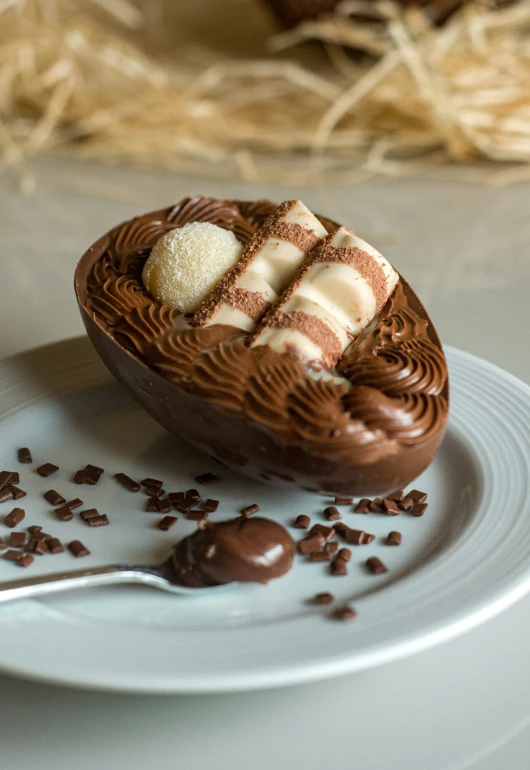 a fork on a plate next to a chocolate desert