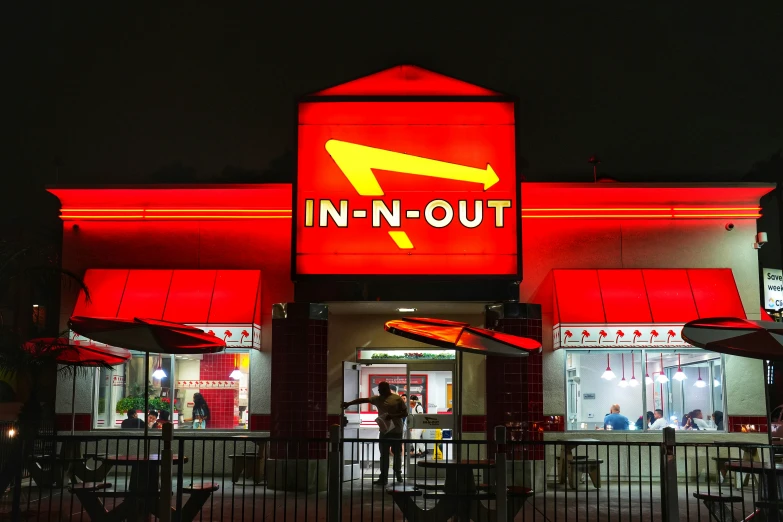 a lit up restaurant with red lights