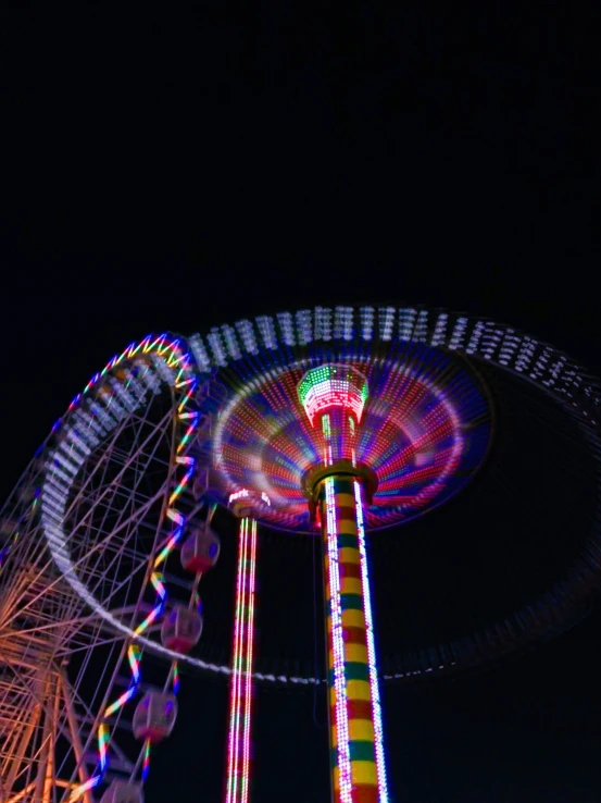 the carnival rides at night are all lit up