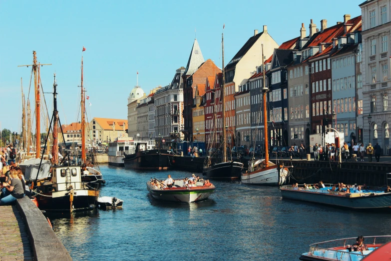 several boats in the water near buildings