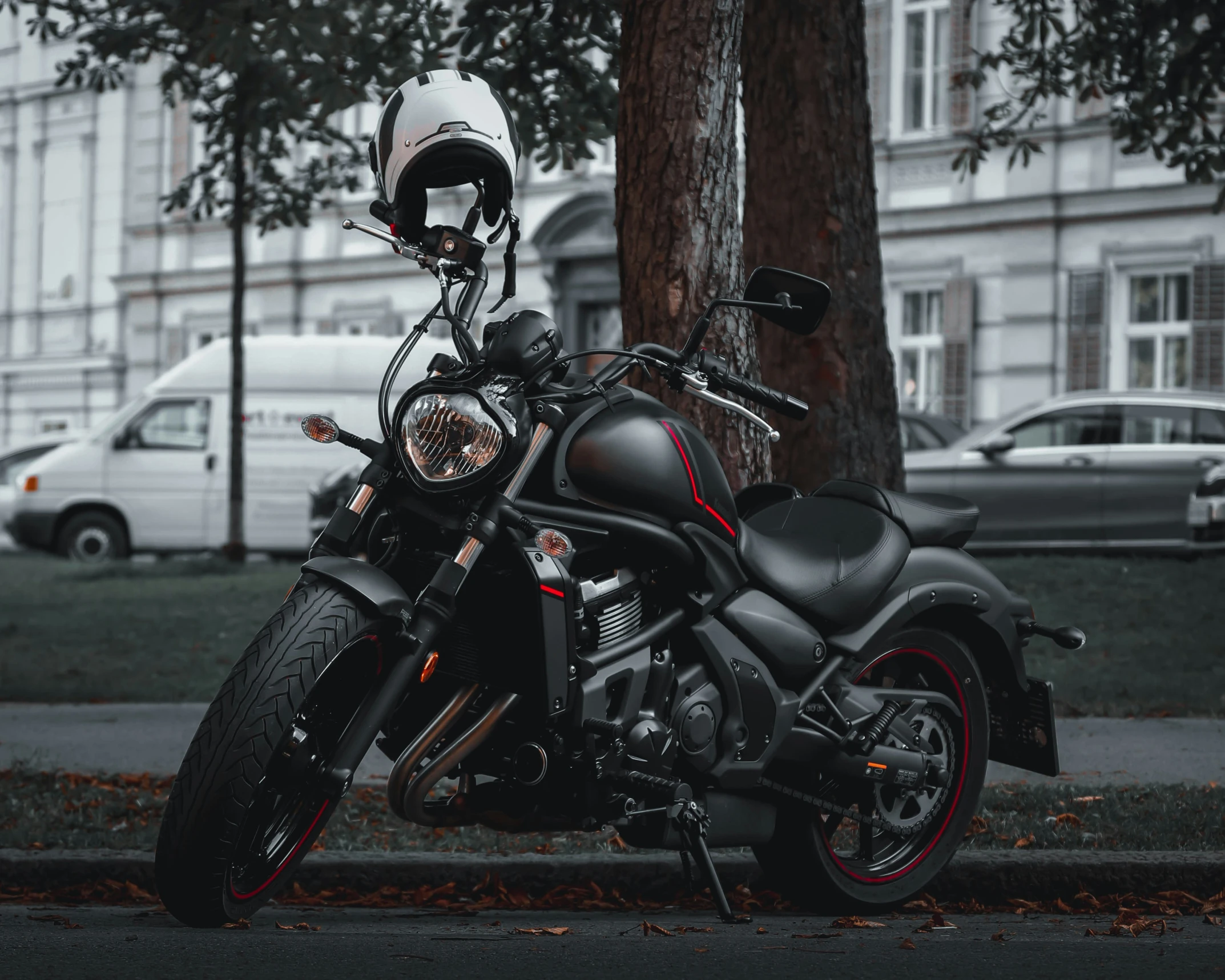 a black motorcycle parked on the side of a street