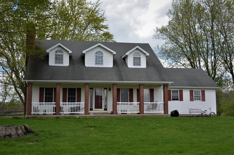 a home sits empty with lots of lawn grass