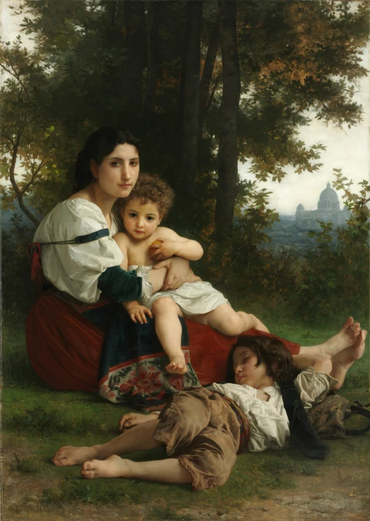 a woman holding her little girl by the tree