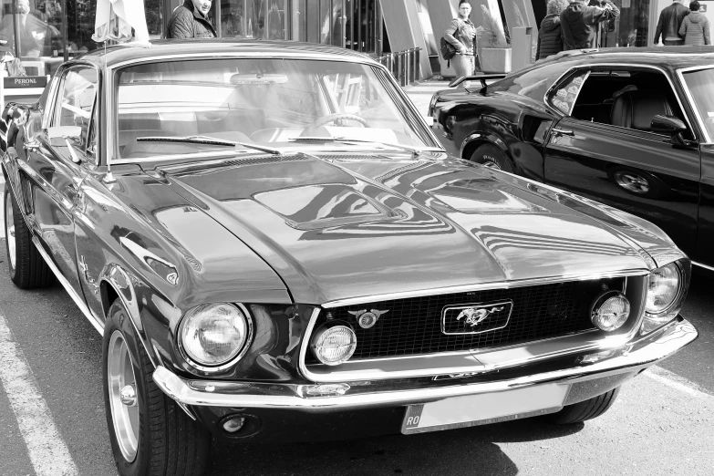 an old mustang sitting in the middle of the road