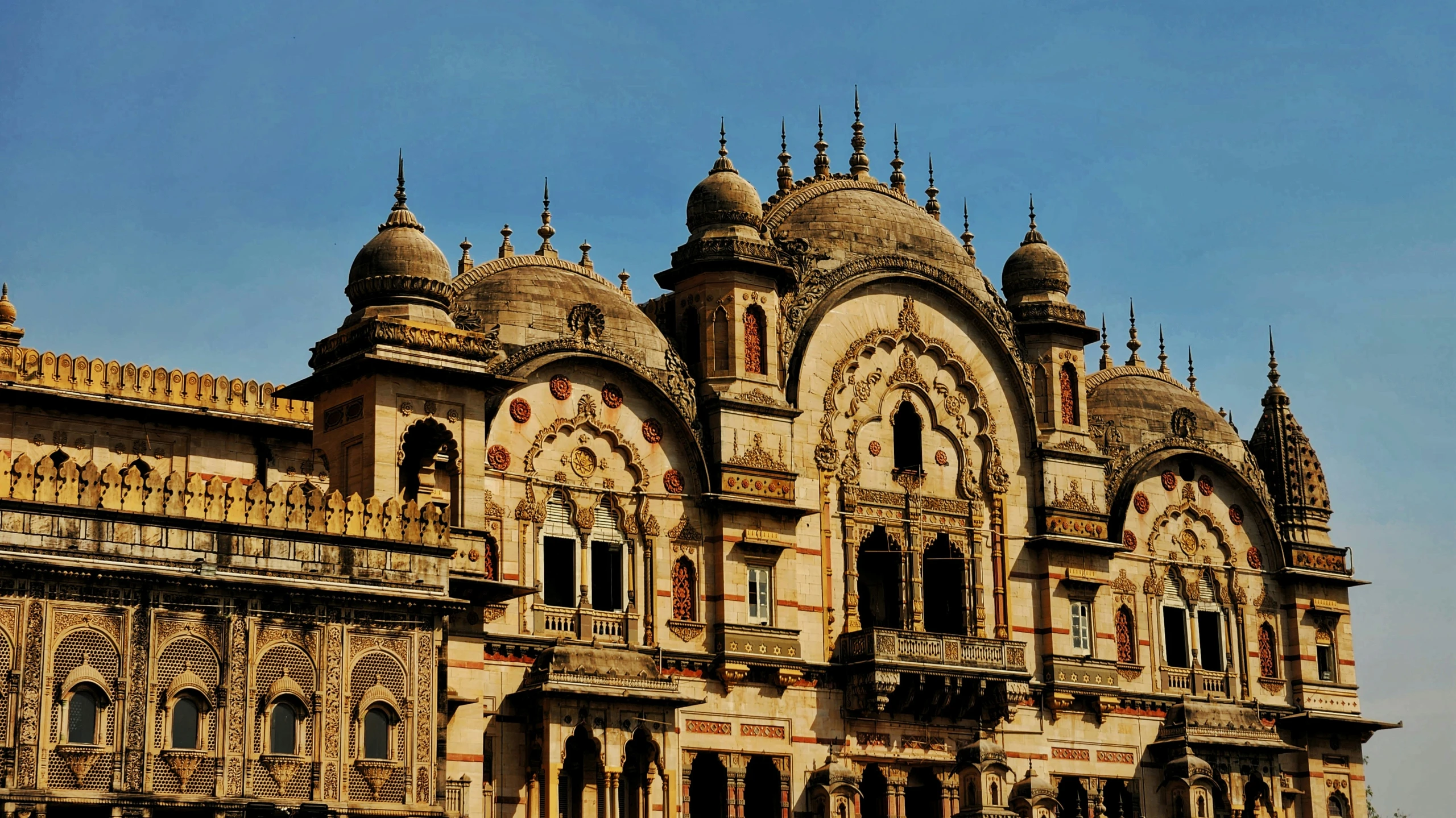 old indian building in an urban setting with many windows