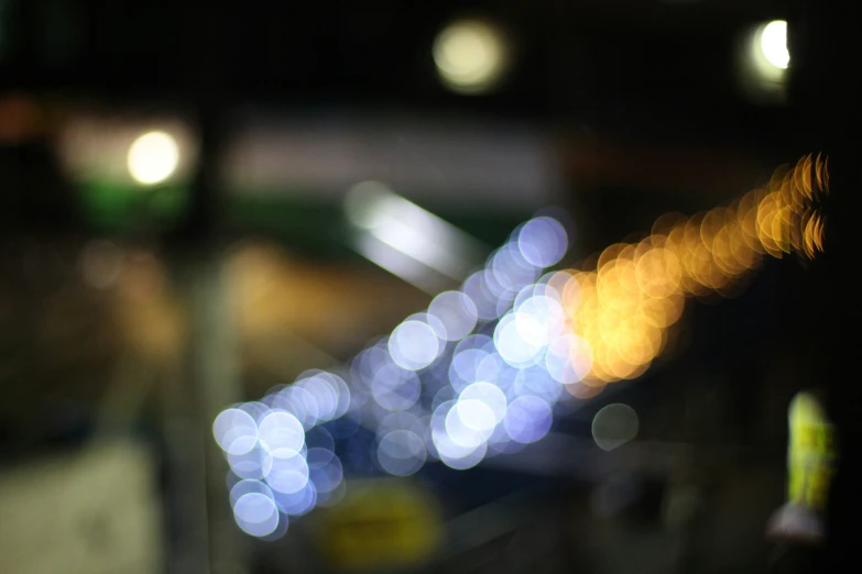 blurry image of cars in the dark on a busy road