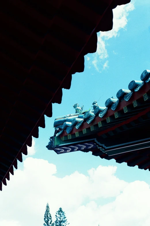 the roof of the temple features blue sky and clouds