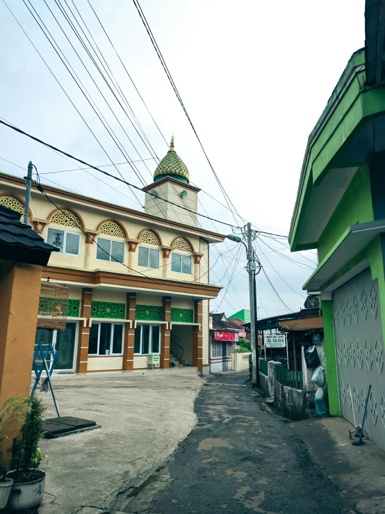 a small market building in front of some electrical wires